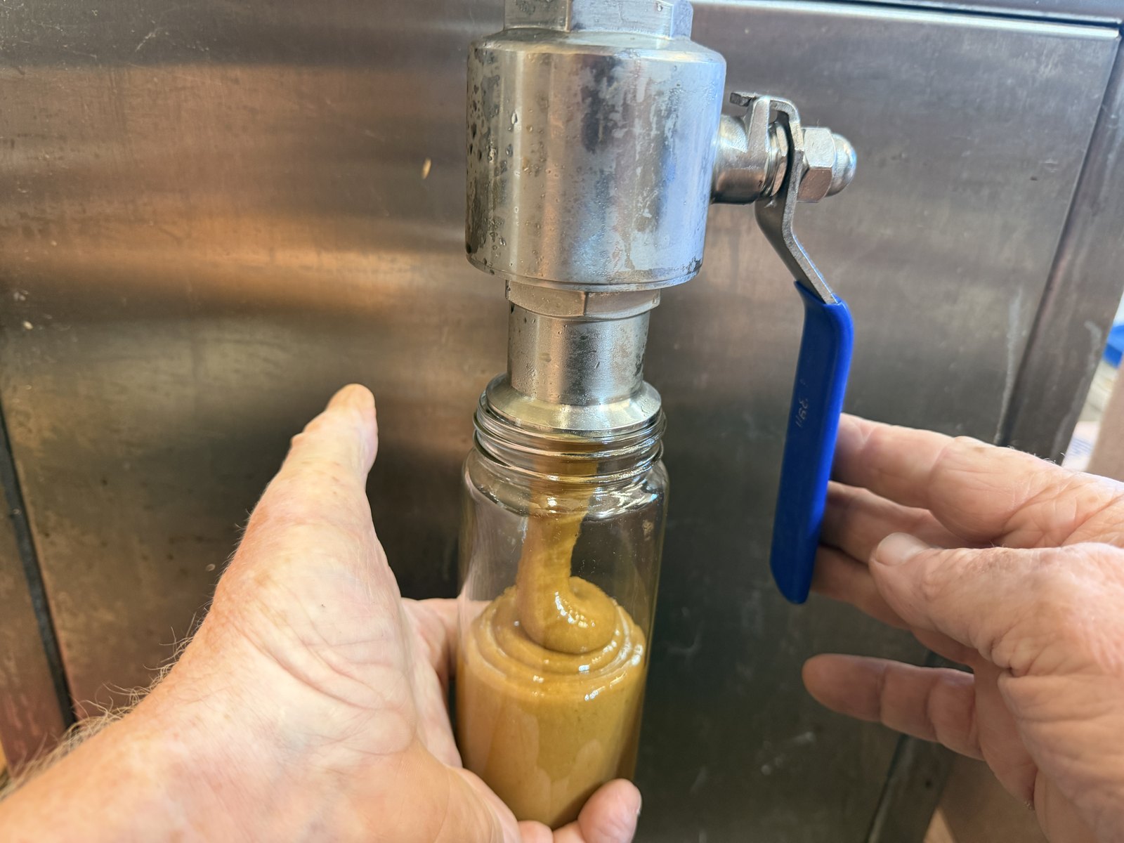 Honey Breeze jar being filled fresh from the tank