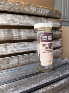 38° Honey Breeze jar on rustic wood – angle view