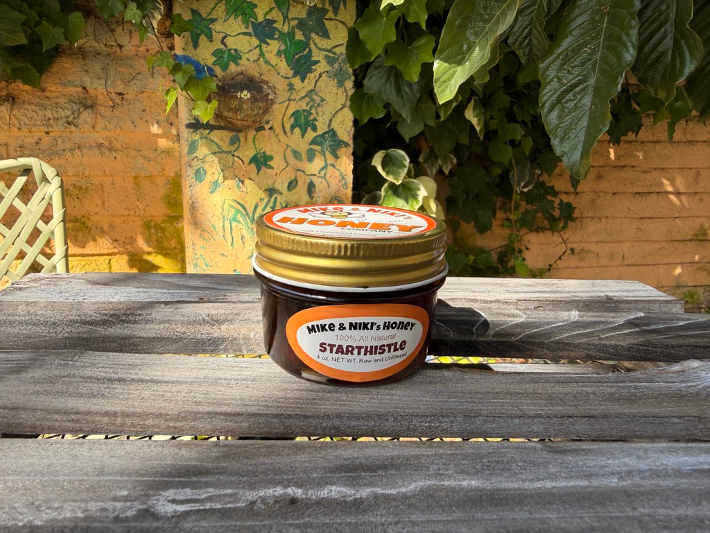 Starthistle Honey 4oz jar dark background